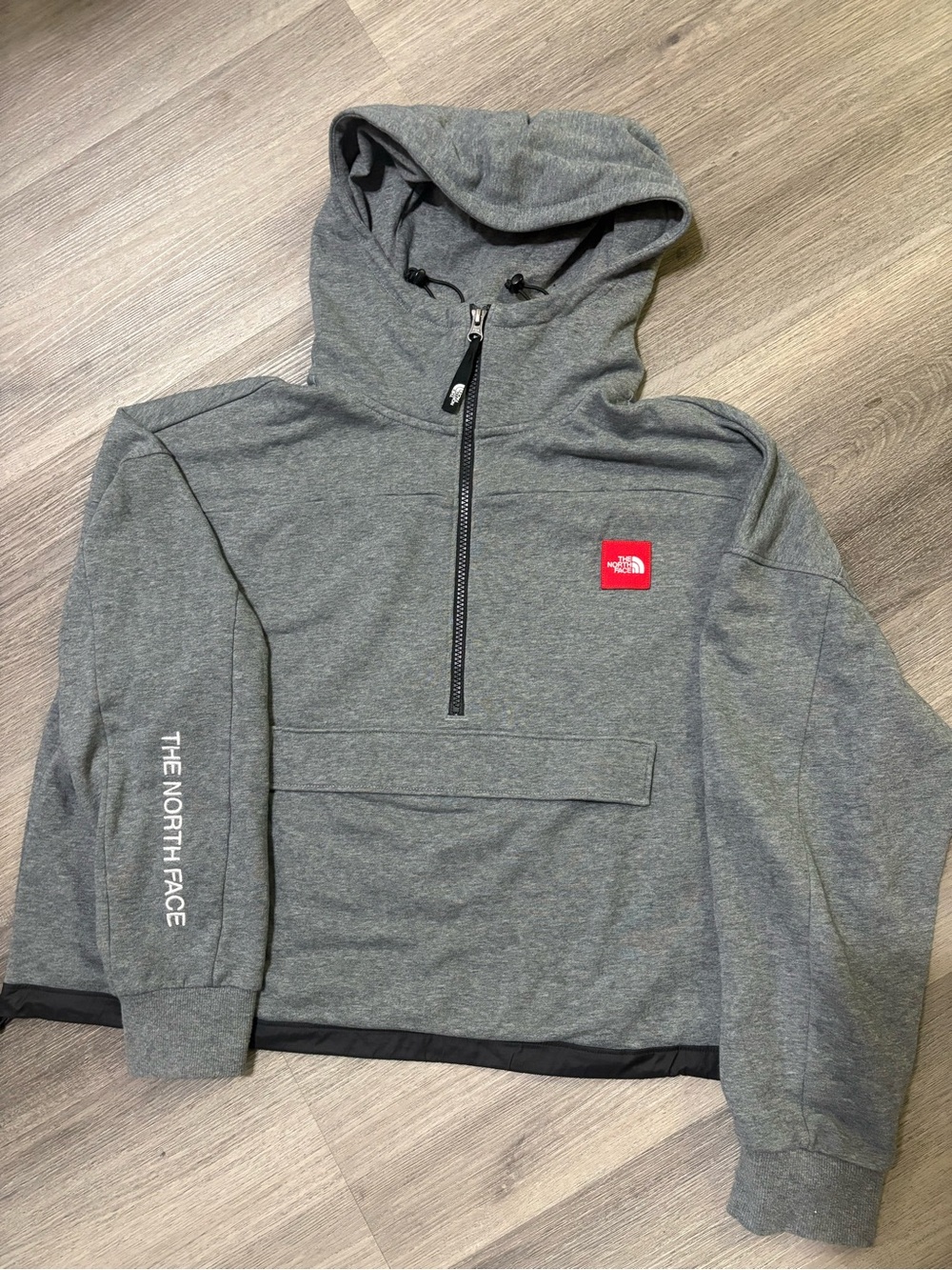 The North Face Woman’s Gray Half-Zip Hooded Pullover with Red Logo